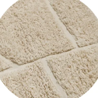 Cream rug with a carved pattern